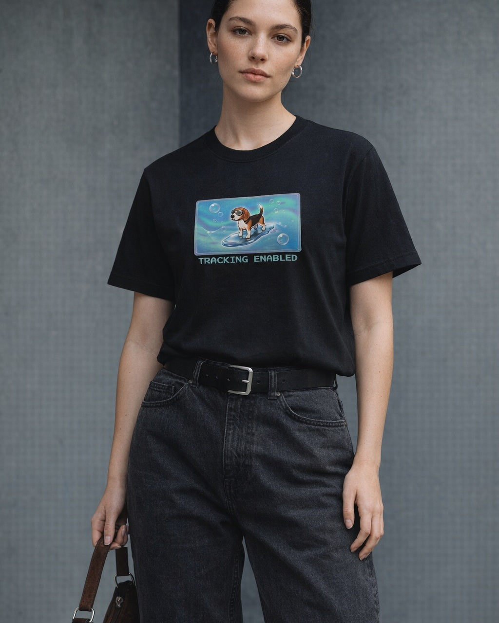 O's Tees Tracking Enabled Beagle Frutiger Aero Dogs graphic tee lifestyle image — Black shirt, female shot 01, washed black denim