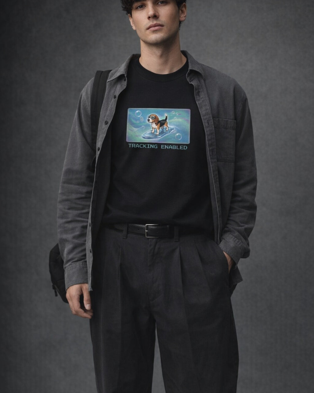 O's Tees Tracking Enabled Beagle Frutiger Aero Dogs graphic tee lifestyle image — Black shirt, male shot 01, charcoal pleated trouser