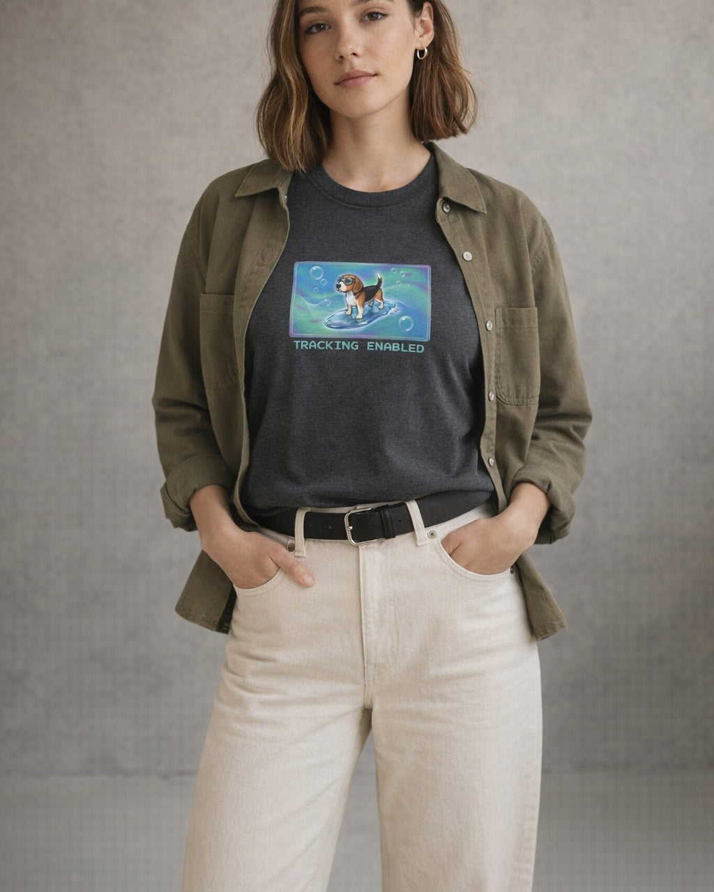 O's Tees Tracking Enabled Beagle Frutiger Aero Dogs graphic tee lifestyle image — Dark Heather shirt, female shot 01, ecru denim olive overshirt