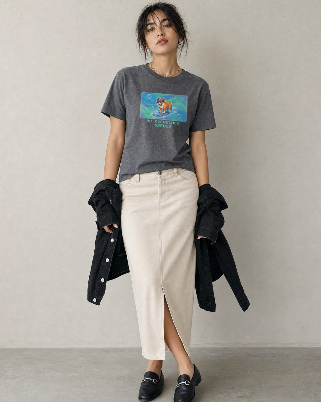 O's Tees No Overclock Needed Bulldog Frutiger Aero Dogs graphic tee lifestyle image — Graphite Heather shirt, female shot 02, stone column skirt black jacket