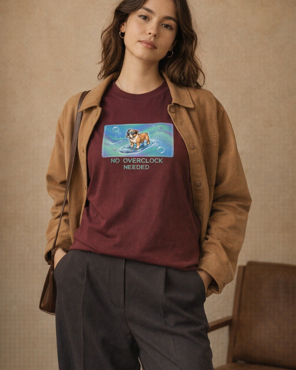 O's Tees No Overclock Needed Bulldog Frutiger Aero Dogs graphic tee lifestyle image — Maroon shirt, female shot 02, charcoal trouser camel