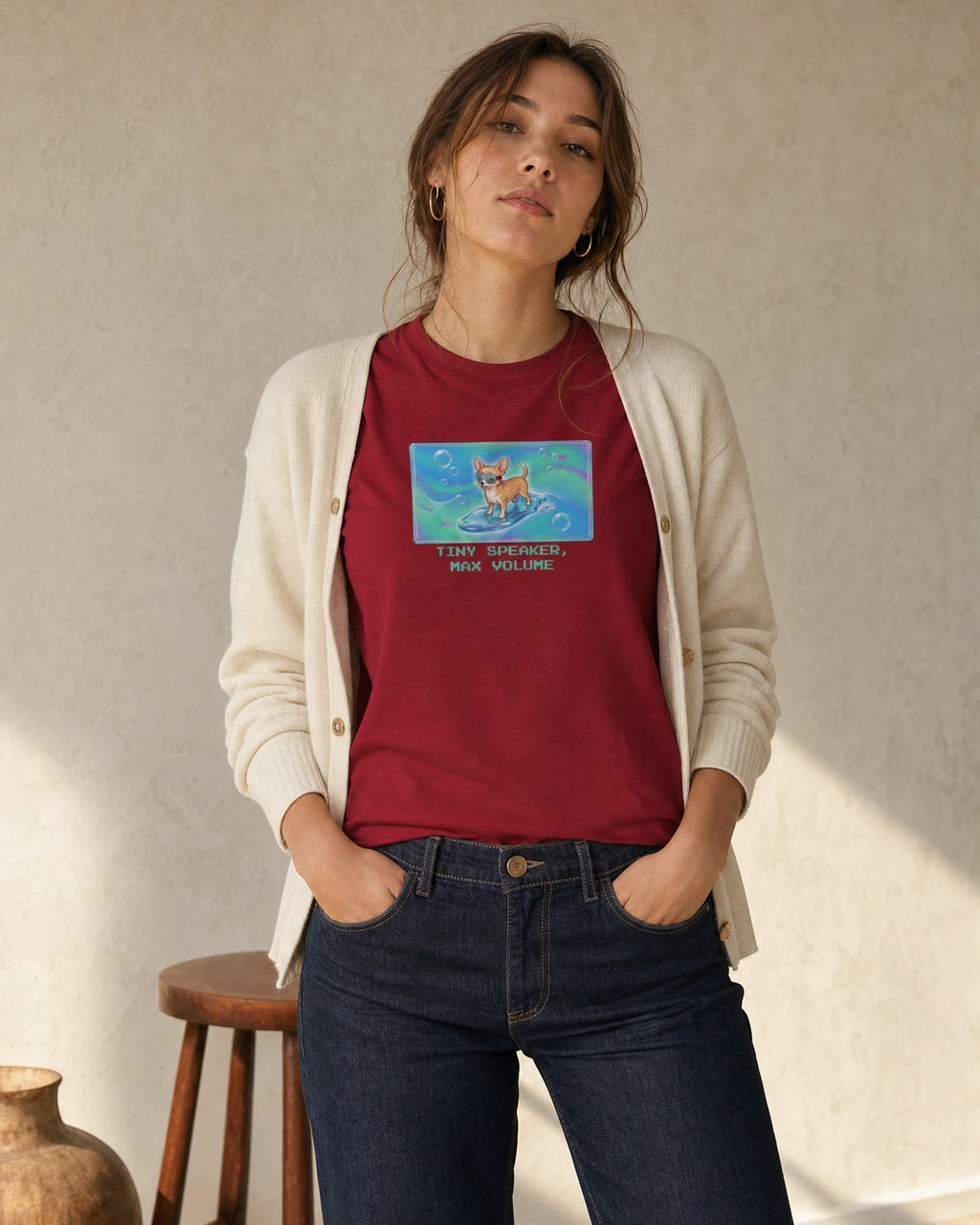 O's Tees Tiny Speaker, Max Volume Chihuahua Frutiger Aero Dogs graphic tee lifestyle image — Cardinal Red shirt, female shot 01, dark indigo cream cardigan