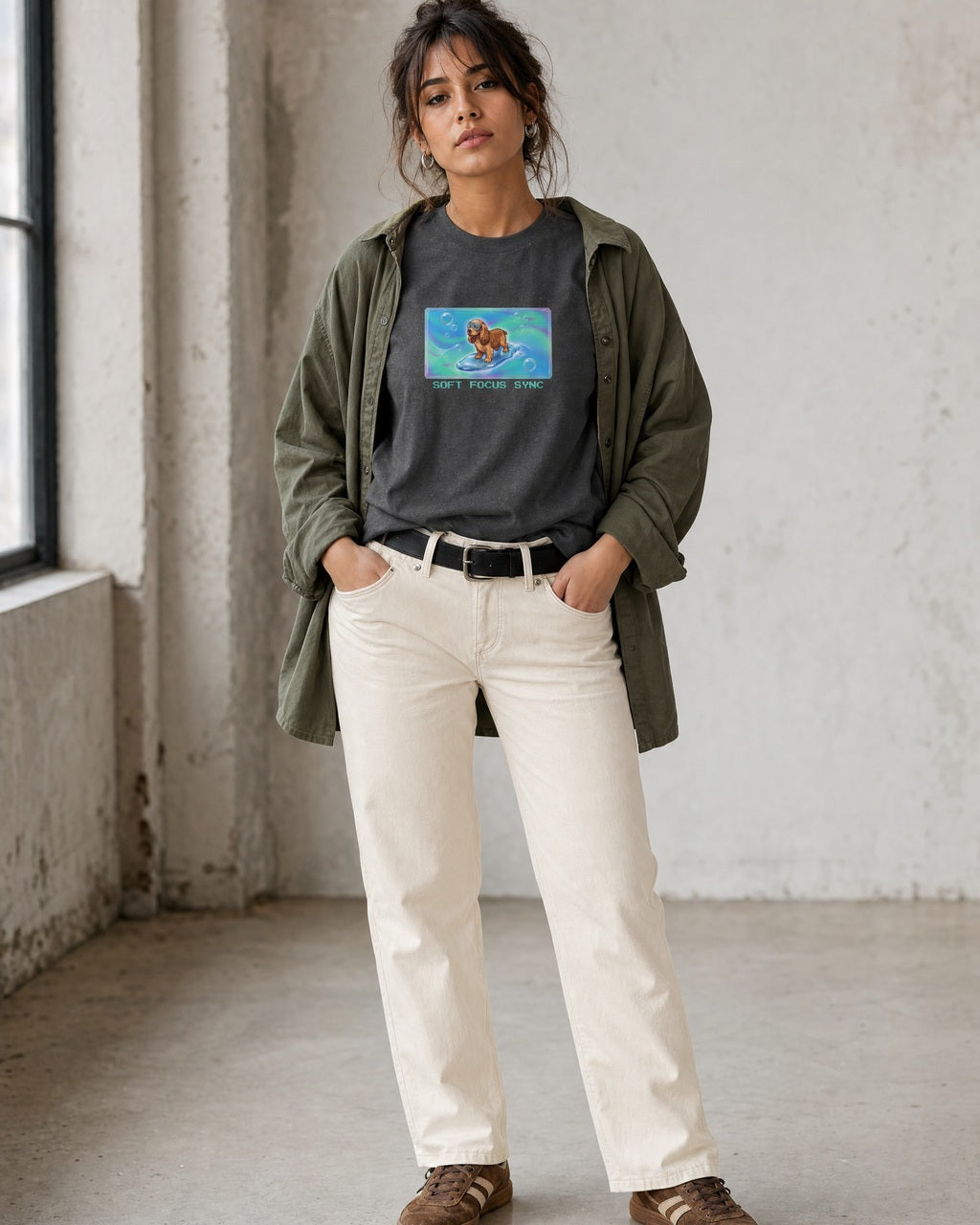 O's Tees Soft Focus Sync Cocker Spaniel Frutiger Aero Dogs graphic tee lifestyle image — Dark Heather shirt, female shot 01, ecru denim olive overshirt