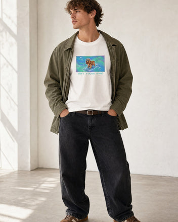 O's Tees Soft Focus Sync Cocker Spaniel Frutiger Aero Dogs graphic tee lifestyle image — White shirt, male shot 01, black denim field jacket