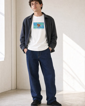 O's Tees Soft Focus Sync Cocker Spaniel Frutiger Aero Dogs graphic tee lifestyle image — White shirt, male shot 02, indigo workwear
