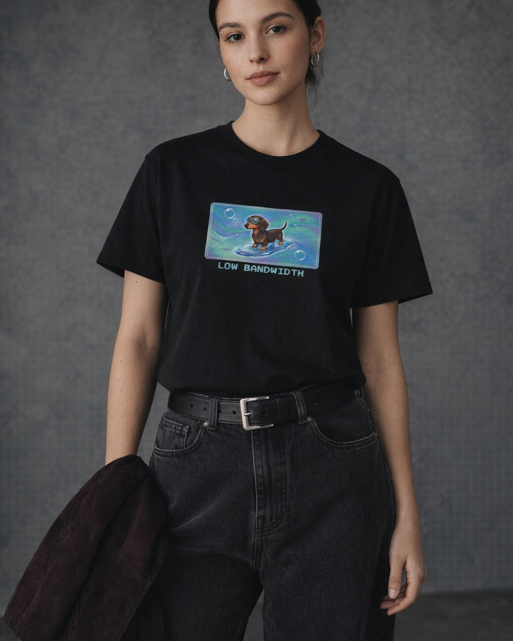 O's Tees Low Bandwidth Dachshund Frutiger Aero Dogs graphic tee lifestyle image — Black shirt, female shot 01, washed black denim