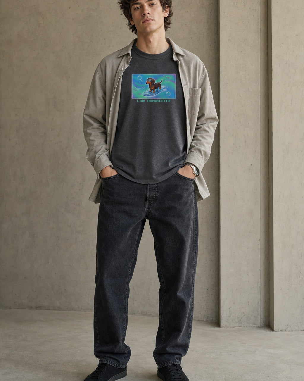 O's Tees Low Bandwidth Dachshund Frutiger Aero Dogs graphic tee lifestyle image — Dark Heather shirt, male shot 02, faded black denim stone overshirt