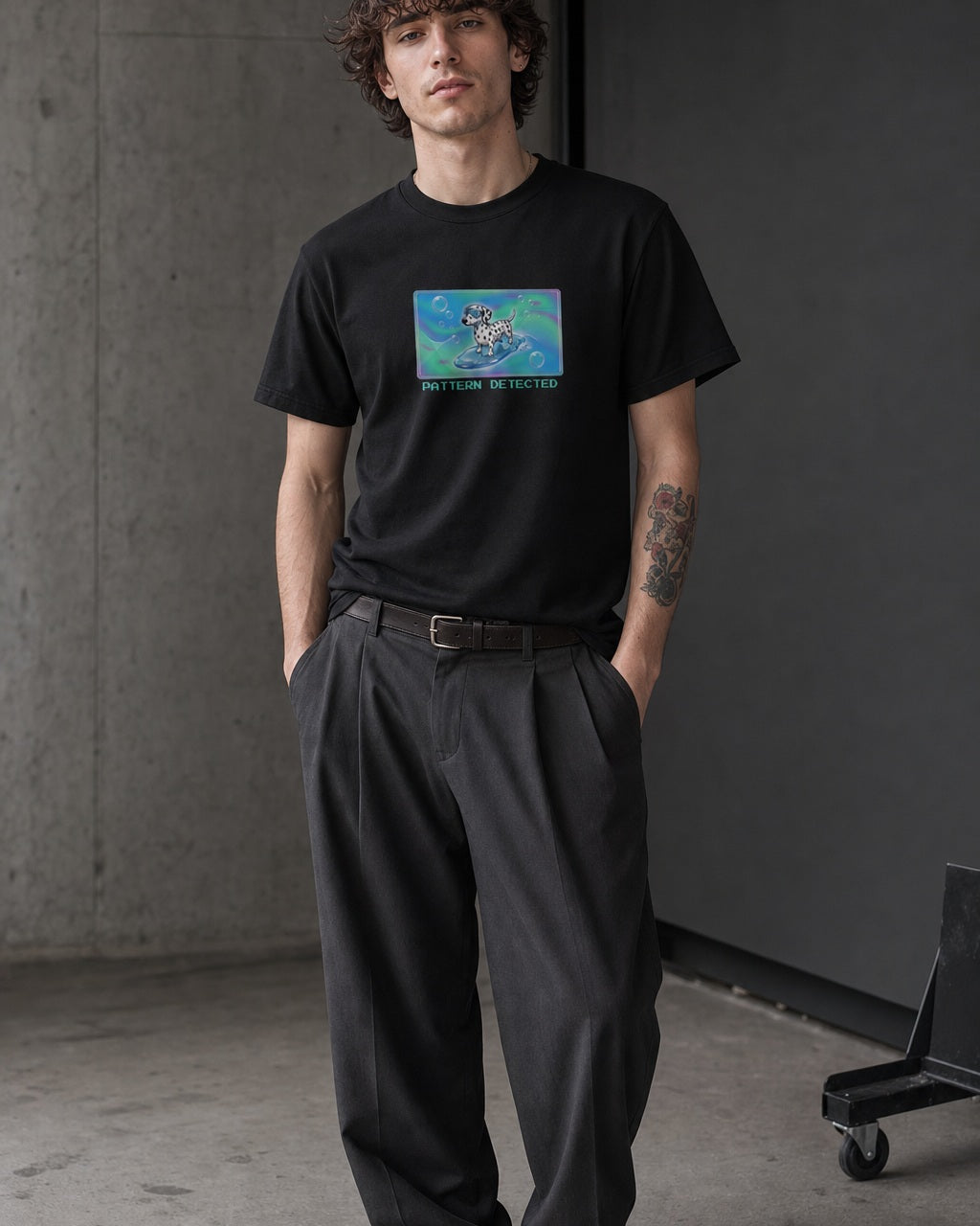 O's Tees Pattern Detected Dalmatian Frutiger Aero Dogs graphic tee lifestyle image — Black shirt, male shot 01, charcoal pleated trouser