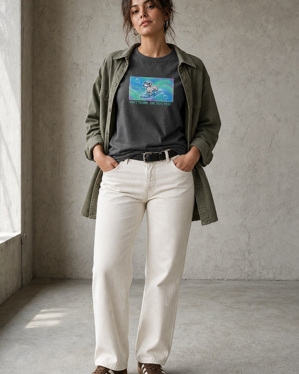 O's Tees Pattern Detected Dalmatian Frutiger Aero Dogs graphic tee lifestyle image — Dark Heather shirt, female shot 01, ecru denim olive overshirt