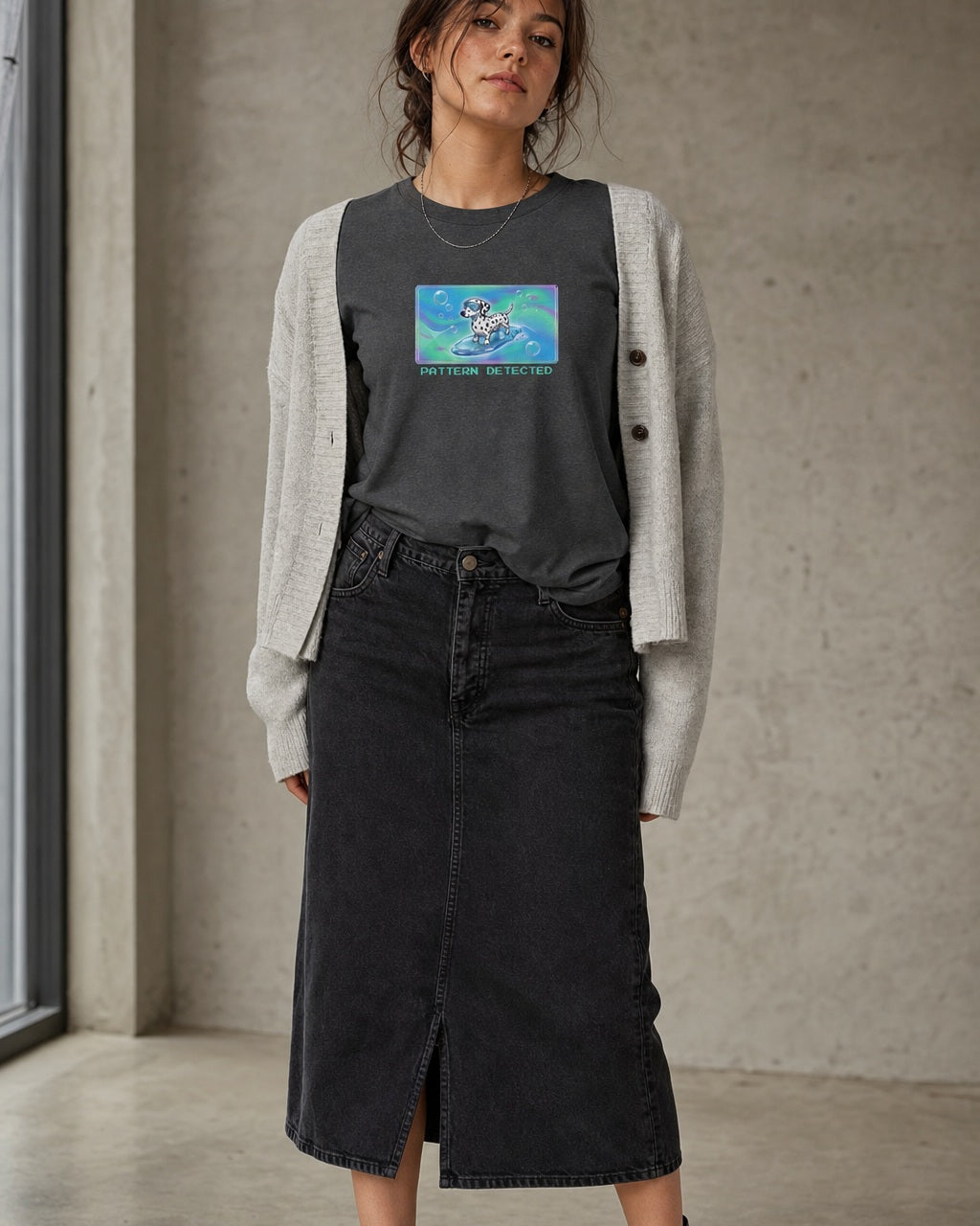 O's Tees Pattern Detected Dalmatian Frutiger Aero Dogs graphic tee lifestyle image — Dark Heather shirt, female shot 02, washed black column skirt