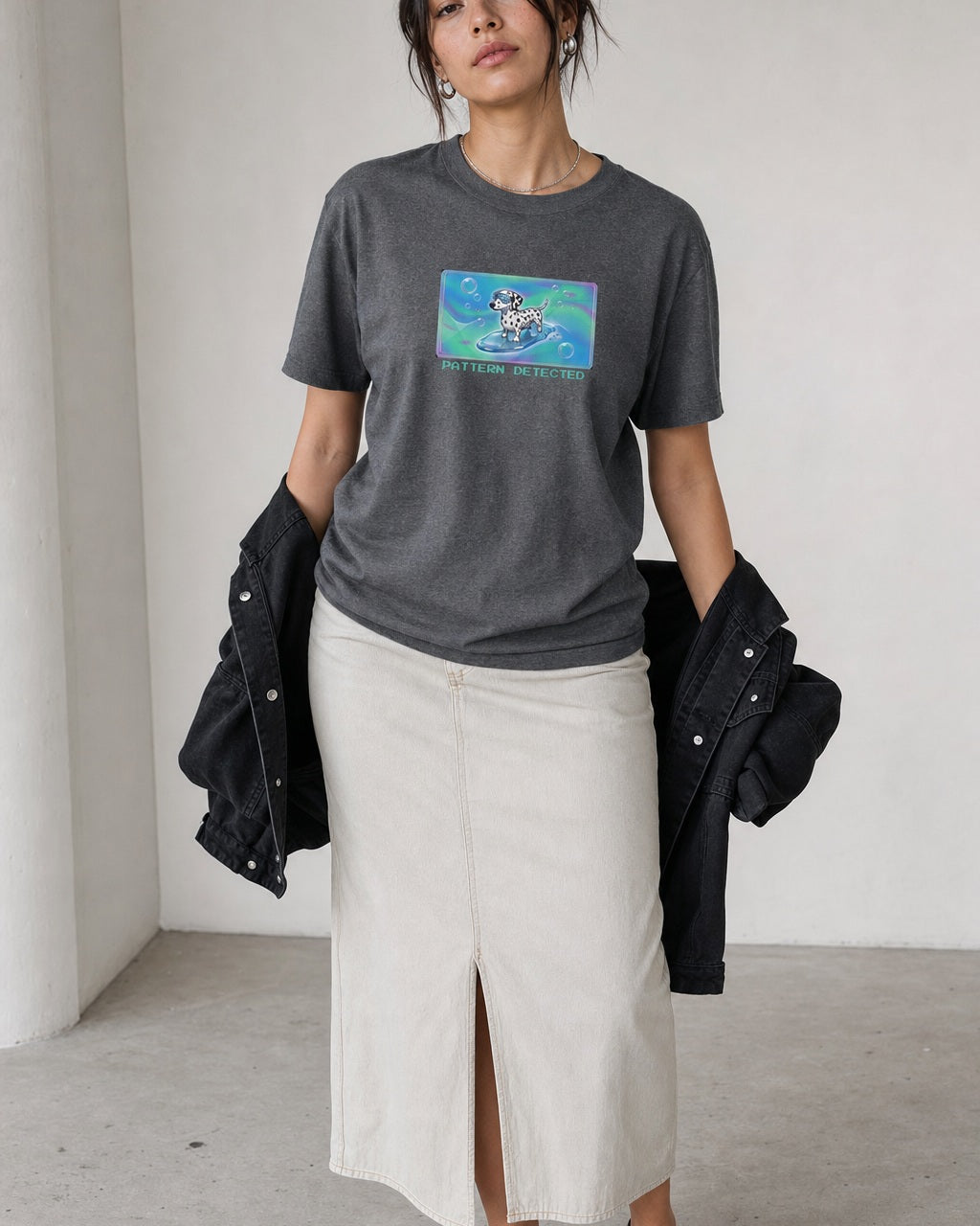 O's Tees Pattern Detected Dalmatian Frutiger Aero Dogs graphic tee lifestyle image — Graphite Heather shirt, female shot 02, stone column skirt black jacket