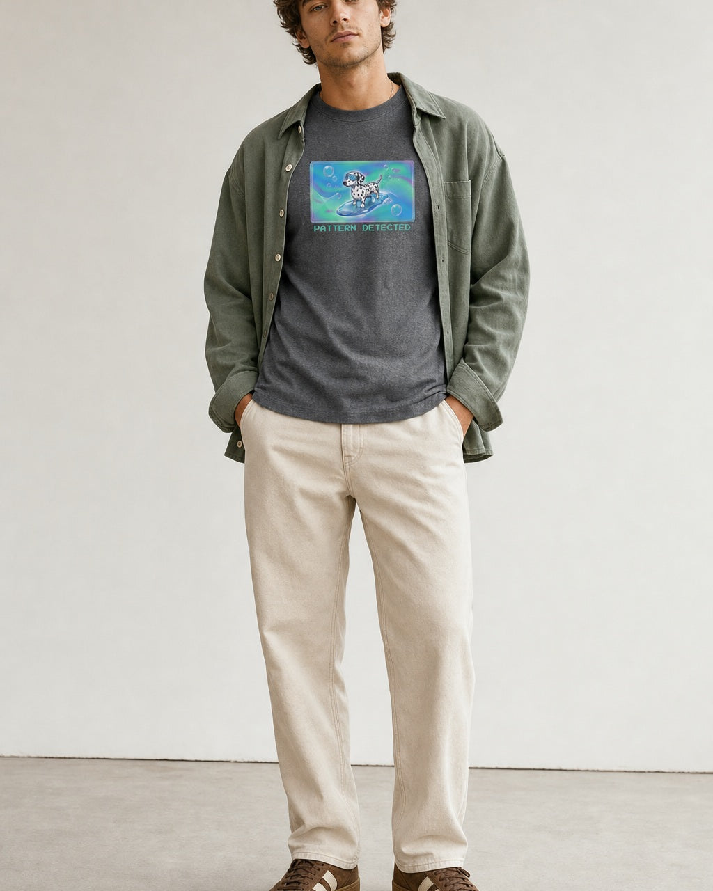 O's Tees Pattern Detected Dalmatian Frutiger Aero Dogs graphic tee lifestyle image — Graphite Heather shirt, male shot 01, stone trouser sage overshirt