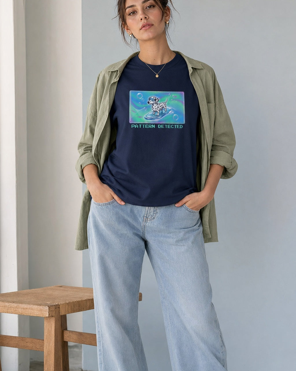 O's Tees Pattern Detected Dalmatian Frutiger Aero Dogs graphic tee lifestyle image — Navy shirt, female shot 02, lightwash sage