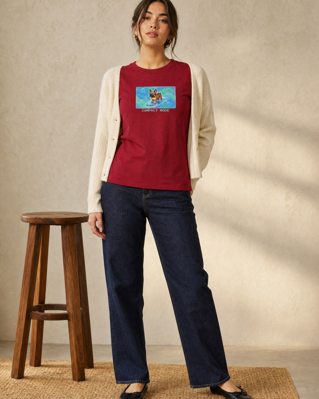 O's Tees Compact Mode French Bulldog Frutiger Aero Dogs graphic tee lifestyle image — Cardinal Red shirt, female shot 01, dark indigo cream cardigan