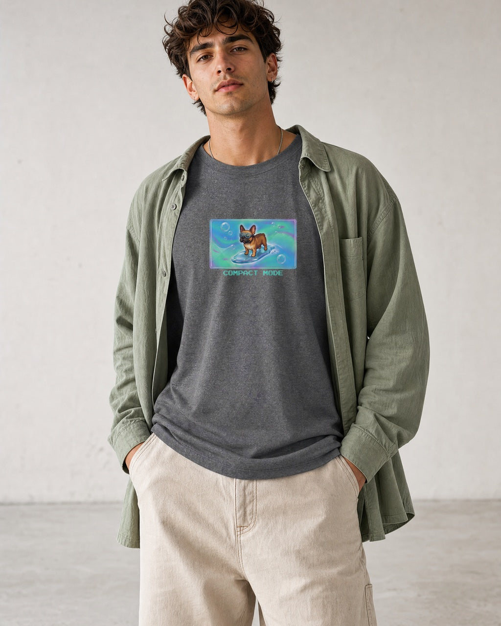 O's Tees Compact Mode French Bulldog Frutiger Aero Dogs graphic tee lifestyle image — Graphite Heather shirt, male shot 01, stone trouser sage overshirt