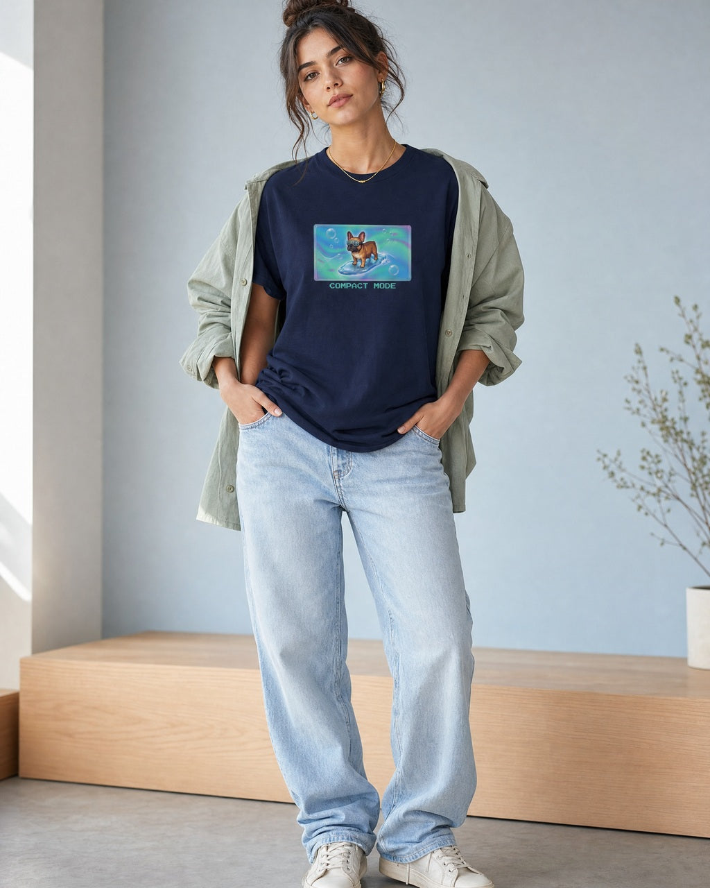 O's Tees Compact Mode French Bulldog Frutiger Aero Dogs graphic tee lifestyle image — Navy shirt, female shot 02, lightwash sage