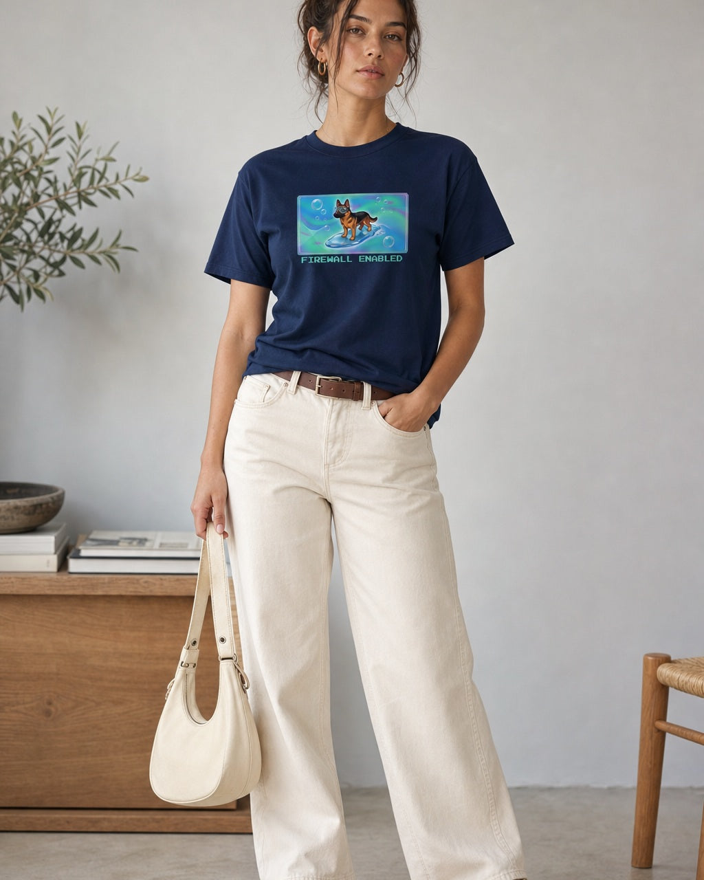 O's Tees Firewall Enabled German Shepherd Frutiger Aero Dogs graphic tee lifestyle image — Navy shirt, female shot 01, ecru barrel tan suede