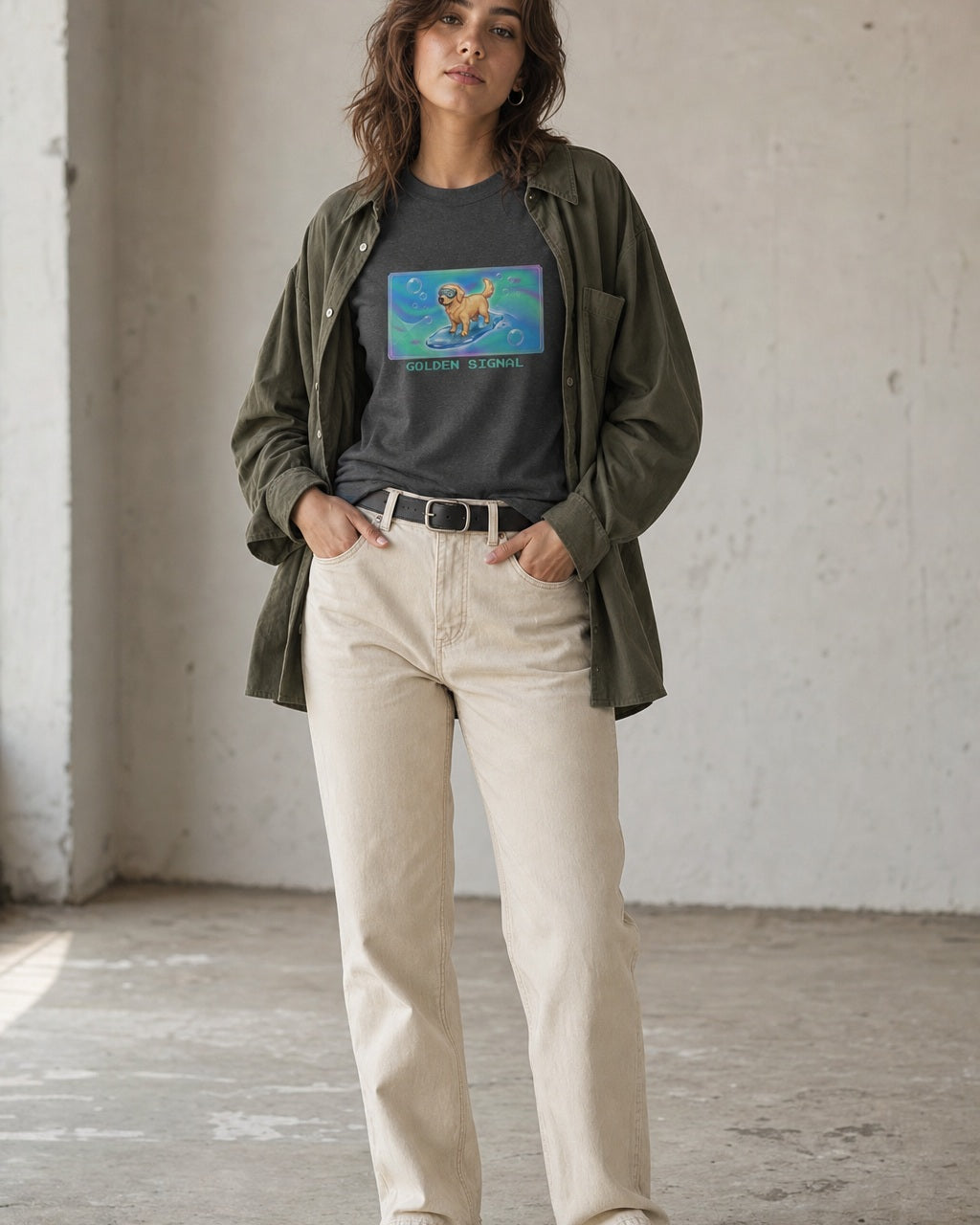 O's Tees Golden Signal Golden Retriever Frutiger Aero Dogs graphic tee lifestyle image — Dark Heather shirt, female shot 01, ecru denim olive overshirt