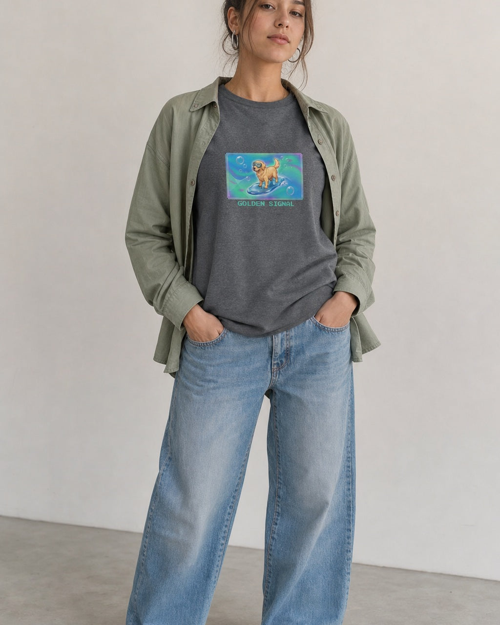 O's Tees Golden Signal Golden Retriever Frutiger Aero Dogs graphic tee lifestyle image — Graphite Heather shirt, female shot 01, washed blue denim sage
