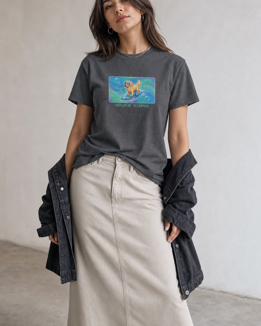 O's Tees Golden Signal Golden Retriever Frutiger Aero Dogs graphic tee lifestyle image — Graphite Heather shirt, female shot 02, stone column skirt black jacket