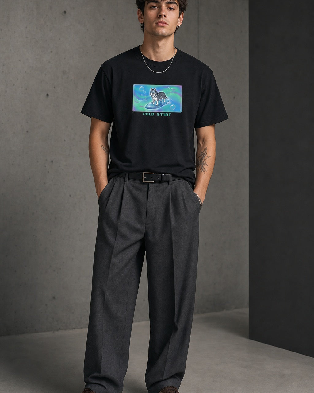 O's Tees Cold Start Husky Frutiger Aero Dogs graphic tee lifestyle image — Black shirt, male shot 01, charcoal pleated trouser